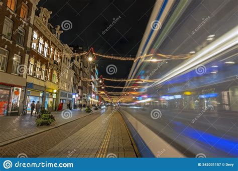 Tram Driving on Damrak in Christmas Time in Amsterdam Netherlands Stock ...