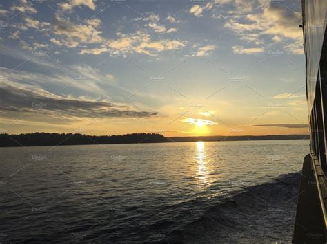 Sunset on a ferry | Nature Stock Photos ~ Creative Market