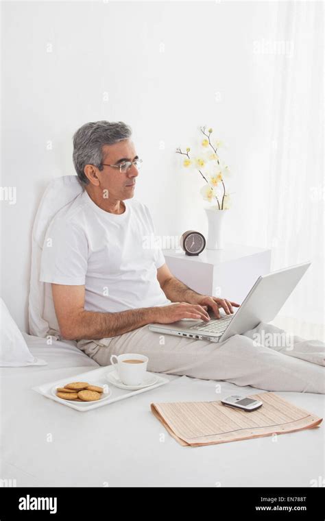 Man working on his laptop Stock Photo - Alamy