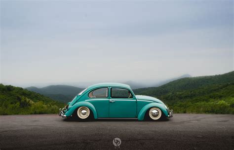 Green Volkswagen Beetle coupe under gray sky, Southern, Worthersee ...