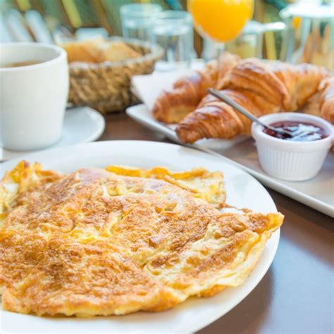 Making Breakfast Special: Traditional French Omelet with Emmental ...