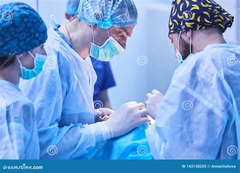 Serious Surgeons during a Surgery in the Hospital. Cross Process Stock ...