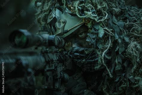 sniper wearing ghillie suit Stock Photo | Adobe Stock