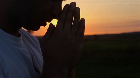 Silhouette of a man praying at sunset concept of religion. Silhouette ...