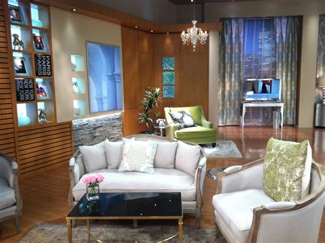 a living room with couches, chairs and a coffee table in front of a window