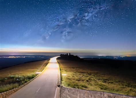 Premium AI Image | Night sky road and starry sky panorama from Mont ...