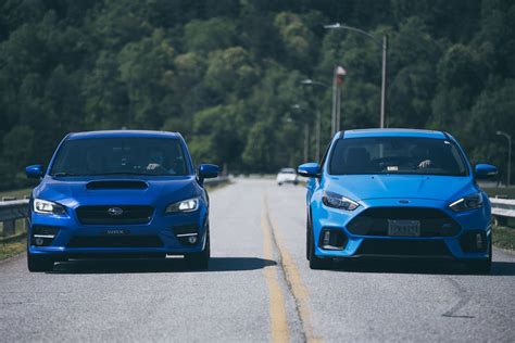 Two Blue Cars on the Road · Free Stock Photo