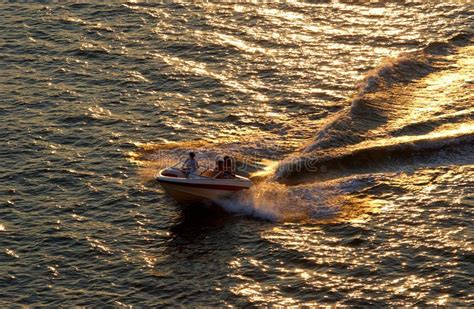 Speedboat at sunset stock photo. Image of recreation, wake - 519056