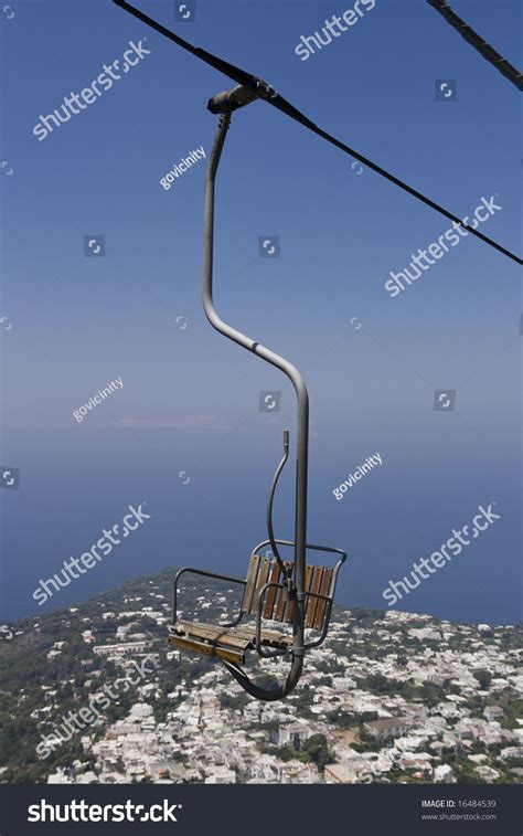 A Chairlift On It'S Way Up To Monte Salero Overlooking Anacapri. Stock ...