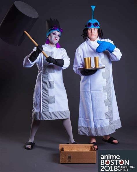 two people dressed in costumes with hats and cooking utensils