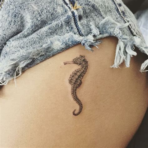 15 Beach-themed tattoos to get to feel like you're on holiday