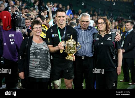 New Zealand's Dan Carter and his family celebrate with the Webb Ellis ...