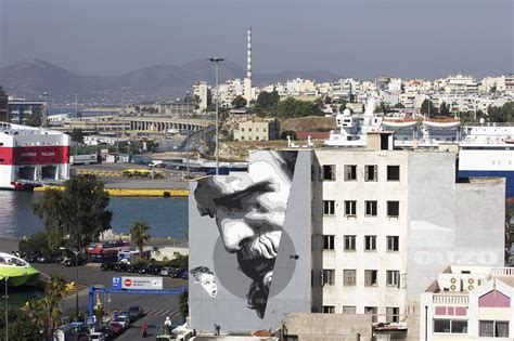 Artist: INO Location: Piraeus, Greece Material: Acrylic paint on wall ...