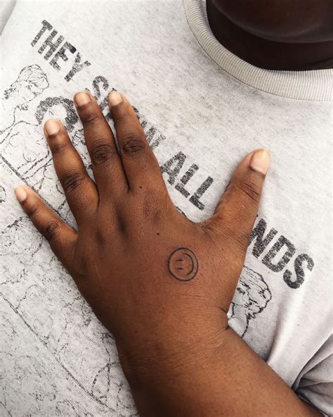 14 Perfectly Placed Hand Tattoo Designs | Hand tattoos, Tattoos, Smiley ...