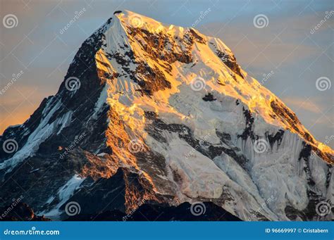 A golden mountain stock image. Image of annapurna, sunrise - 96669997