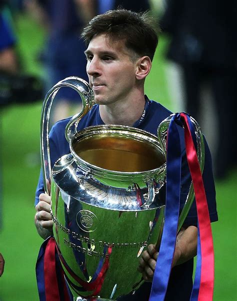 BERLIN, GERMANY - JUNE 06: Lionel Messi of Barcelona holds the trophy ...