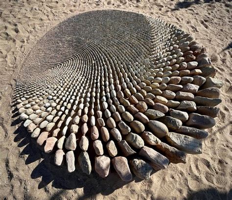 Densely Arranged Stone Gradients Sweep Across the Sand in Jon Foreman's ...