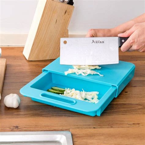 This 3-in-1 Over-The-Sink Cutting Board Lets You Clean, Chop, and Collect