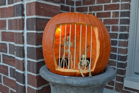 Skeletons in pumpkin jail. Note the on in shackles on the back wall ...