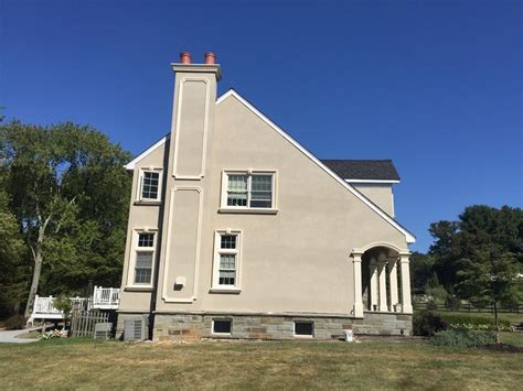 Eifs Siding for a Rustic Exterior with a Siding Stone Veneer ...