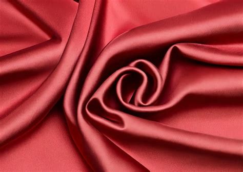 Premium Photo | Red silk fabric with a spiral in the center