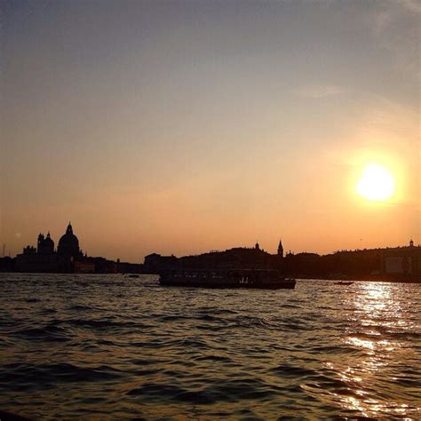 Premium Photo | Ferry in river at sunset