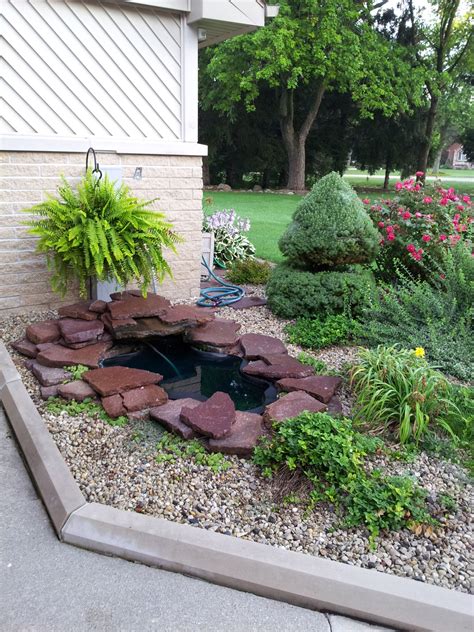 Waterfall in front yard...simple and soothing....work your ideas off of ...