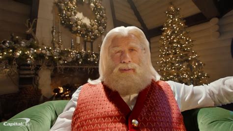 John Travolta Turns Into Santa For Commercial With Samuel L. Jackson ...