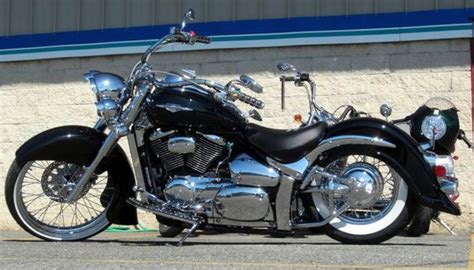 a black motorcycle parked in front of a building