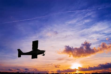 Premium Photo | Airplane silhouette at sunset