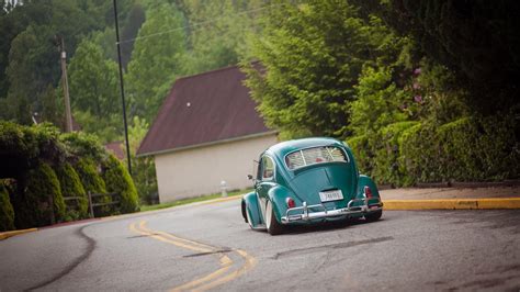 Green Volkswagen Beetle on gray asphalt road during daytime HD ...