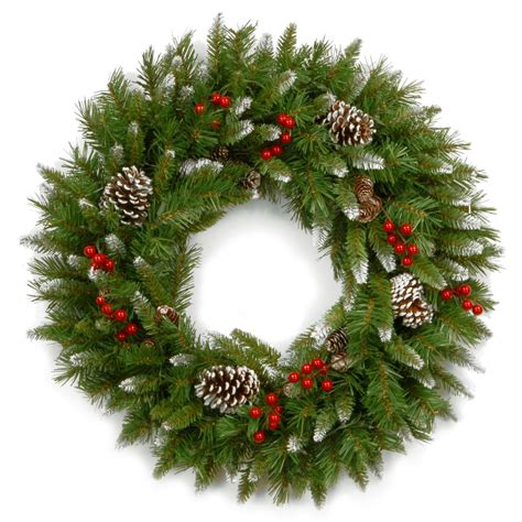 a christmas wreath with pine cones and red berries