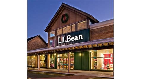 a lit up store front at night with the lights on