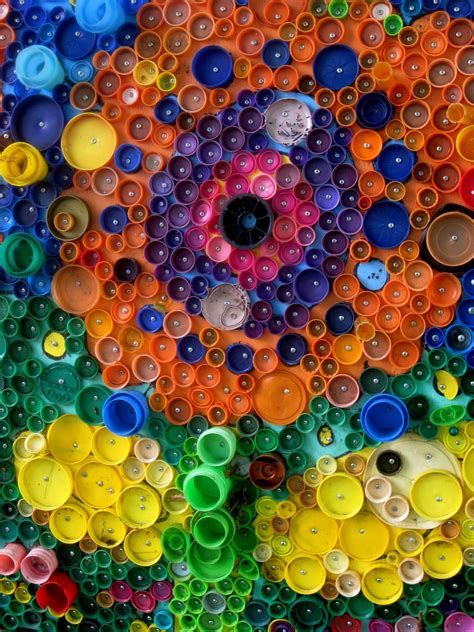 an art work made out of plastic bottle caps and other things that are ...