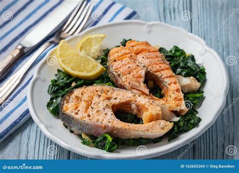 Grilled Rainbow Trout Fillet, Served with Spinach. Stock Image - Image ...