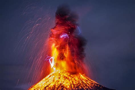 Photographer captures exact moment lightning strikes erupting volcano