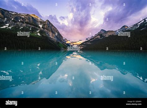 Lake Louise in Banff National Park at sunrise in summer Stock Photo - Alamy