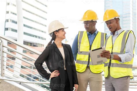 Group of Engineer Worker Wearing Safety Uniform and Hard Hat Uses ...