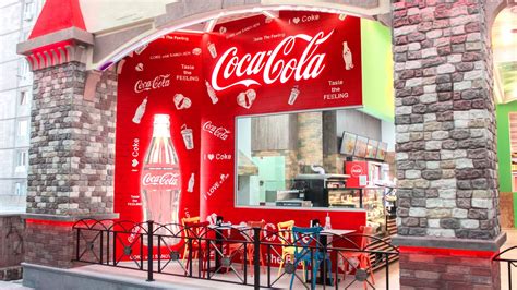 Coca-Cola branded store wall in the theme of the company | Front Signs