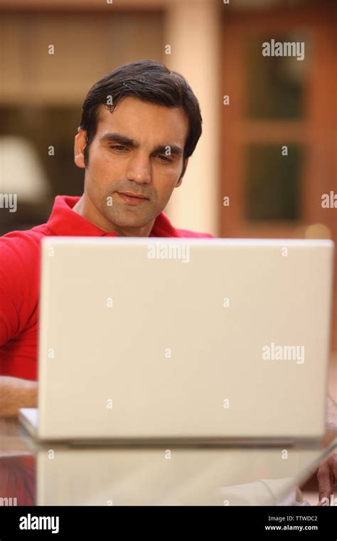 Man working on a laptop Stock Photo - Alamy