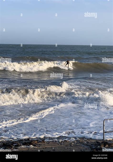 Surfer Youghal beach Ireland Stock Photo - Alamy