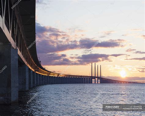 Oresund Bridge and sea in sunset light — dramatic light, sunshine ...