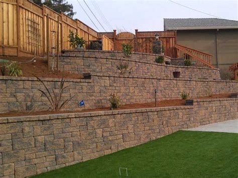 Retaining Wall Tames Slope - Creates Usable Space | Landscaping ...