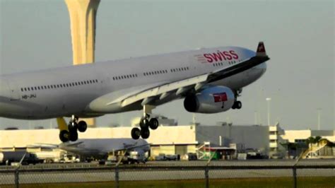 swiss a330 spectacular crosswind landing at miami. - YouTube