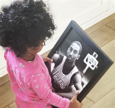 Kobe Bryant's Daughter Capri Looking at a Photo Of Him In His Early ...