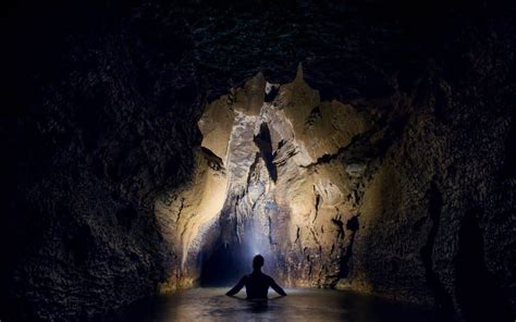 Into the Abyss: Black Water Rafting at the Waitomo Caves - Migrating Miss