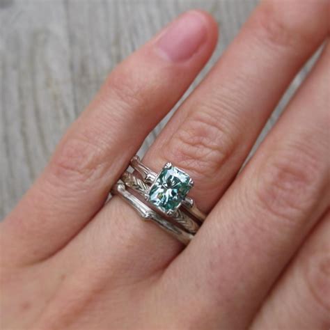 A minty green moissanite ring by Kristin Coffin | Nature inspired ...