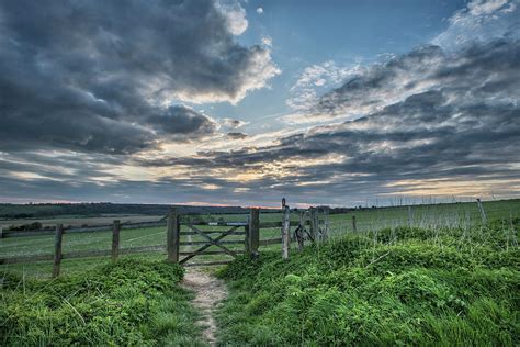 Beautiful English countryside landscape over fields at sunset ...