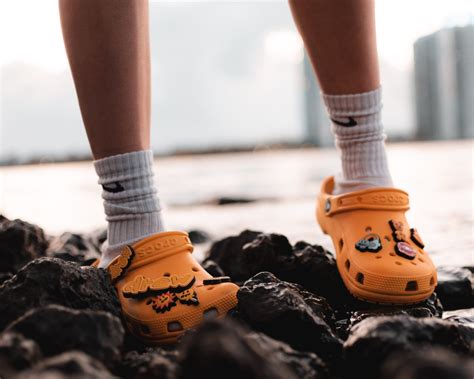 Person Wearing Yellow Crocs · Free Stock Photo