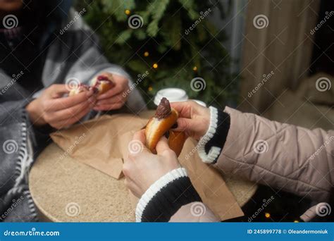 German Donuts - Berliner with Filling and Icing Sugar in Female Hands ...